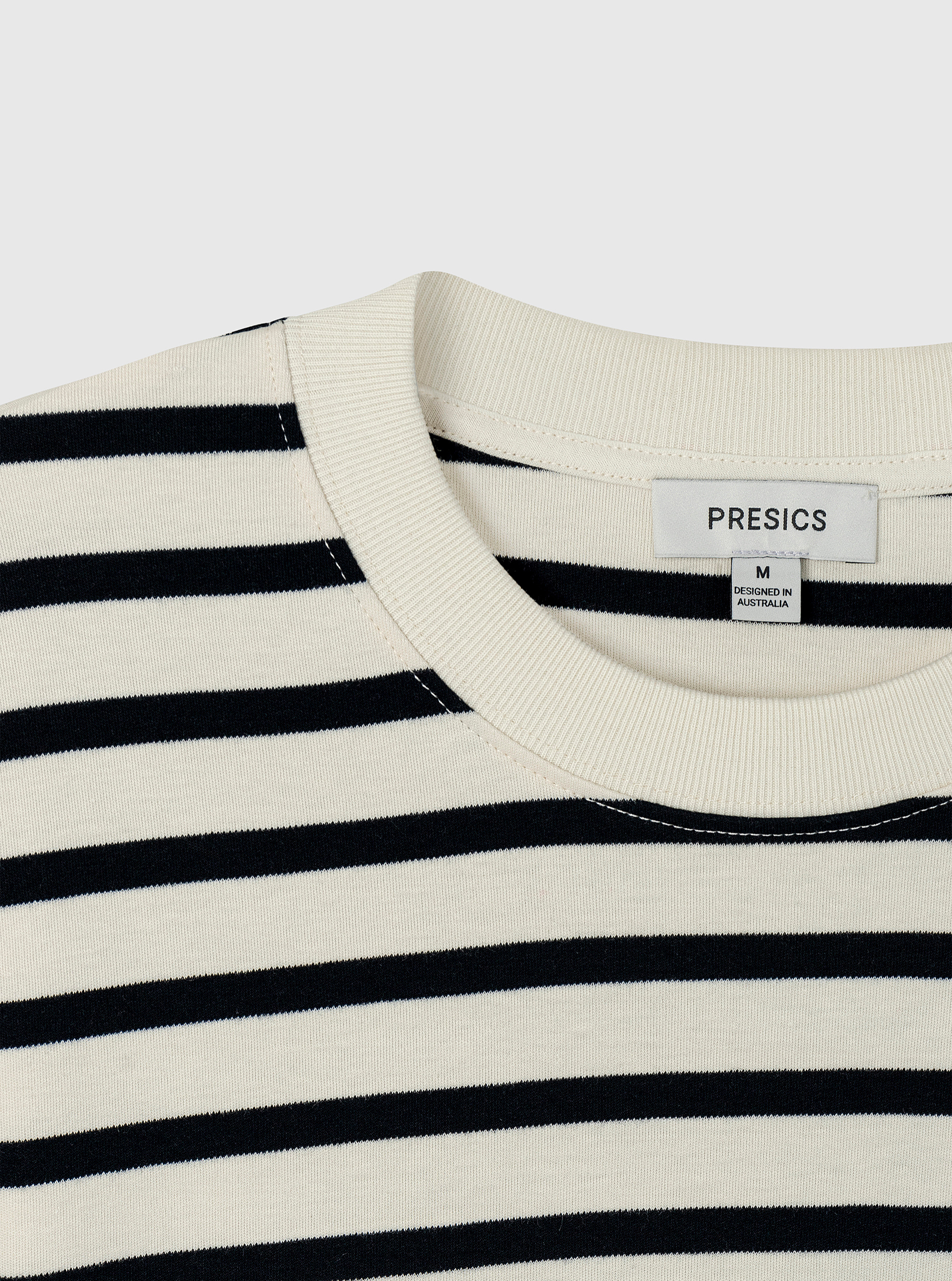 Stripe White/Navy|Black and white striped t-shirt on a light gray background|Stripe White/Navy