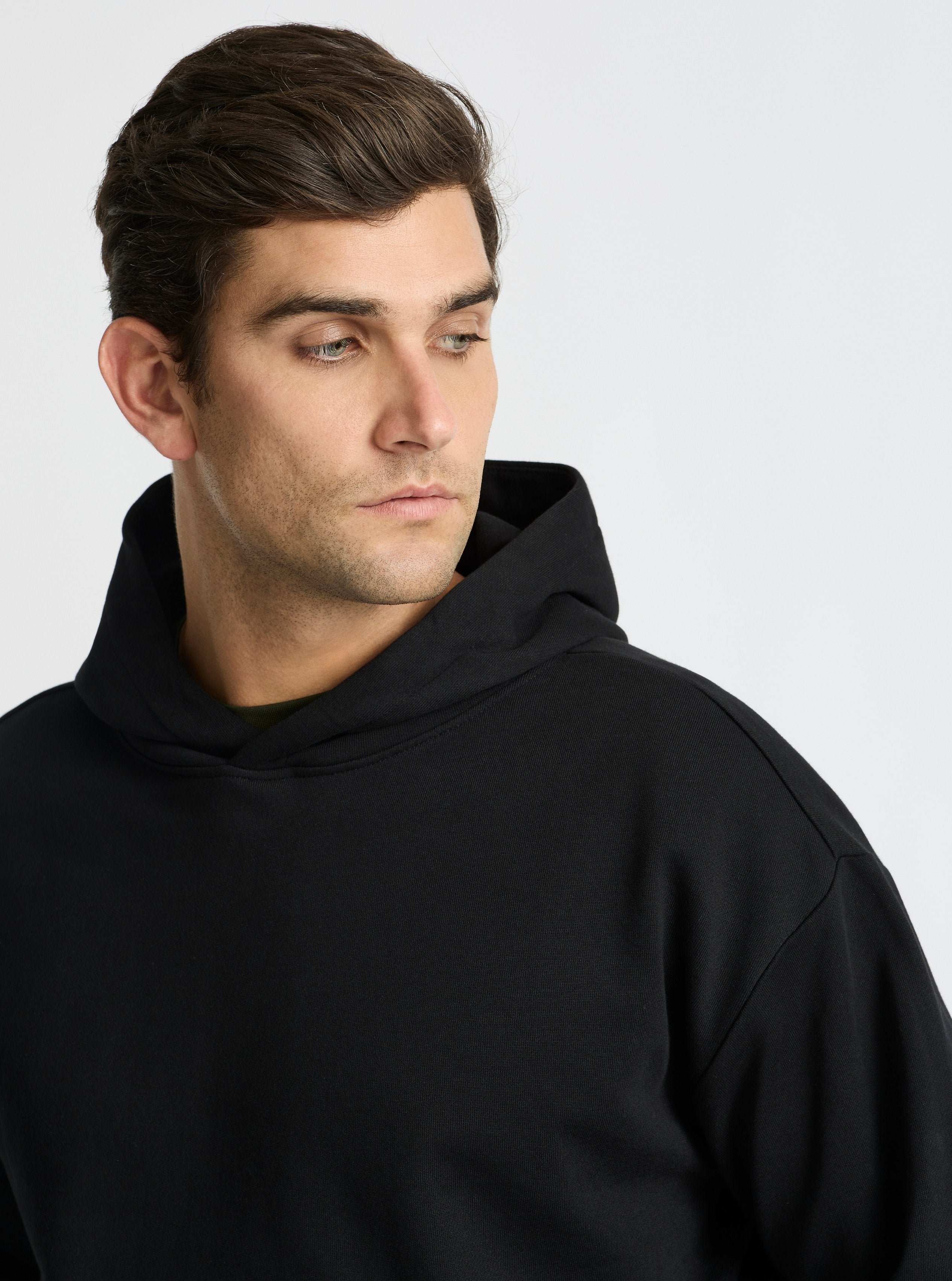 Black|Good Earth Cotton® Hoodie for men – Sustainable Cotton Hoodie|Jack is 6’2” and wearing a size L